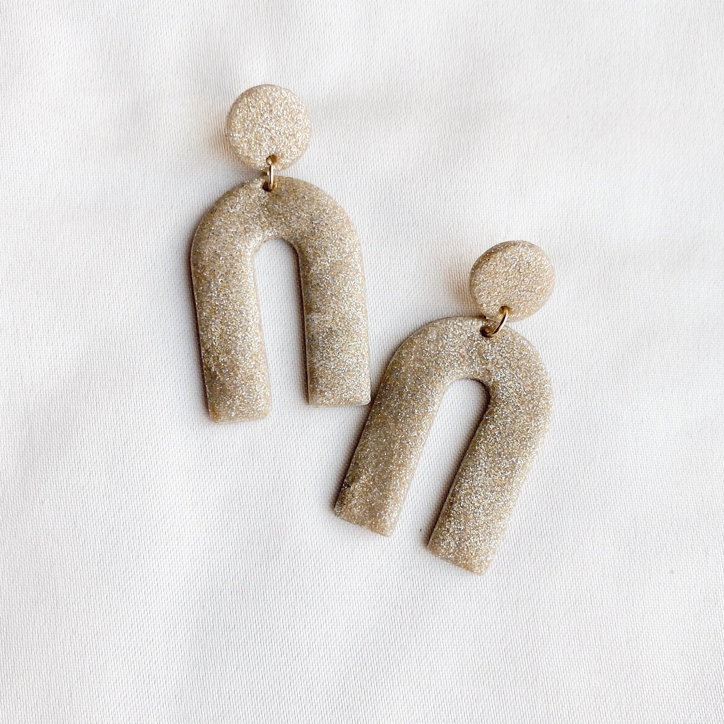 The Stella Arch in Gold Sparkle Earrings